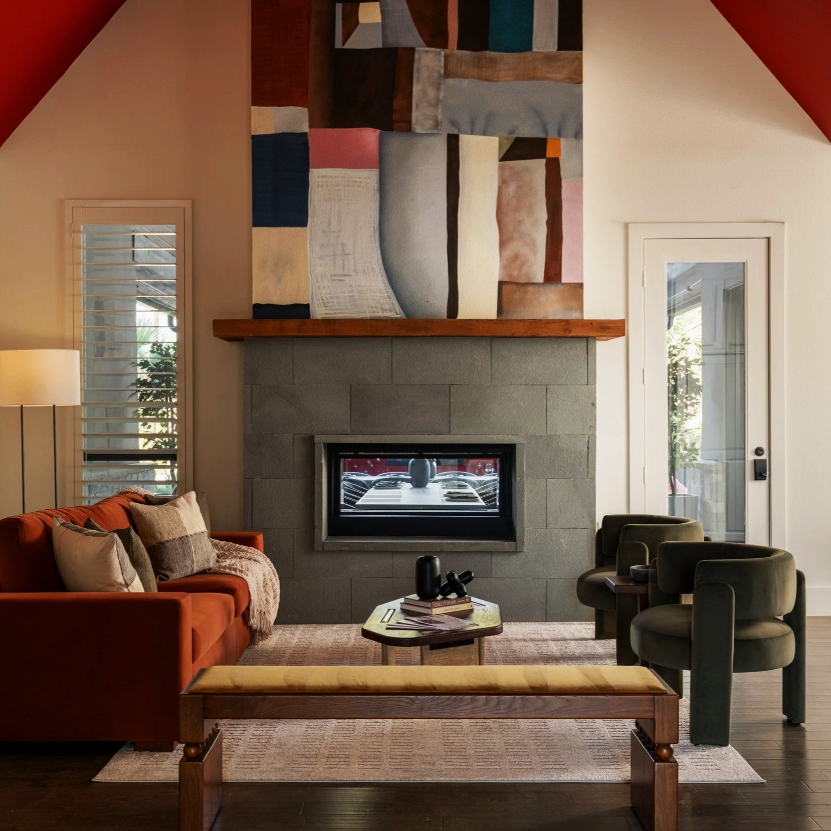 Modern living room with fireplace and contemporary art at The Penrose House