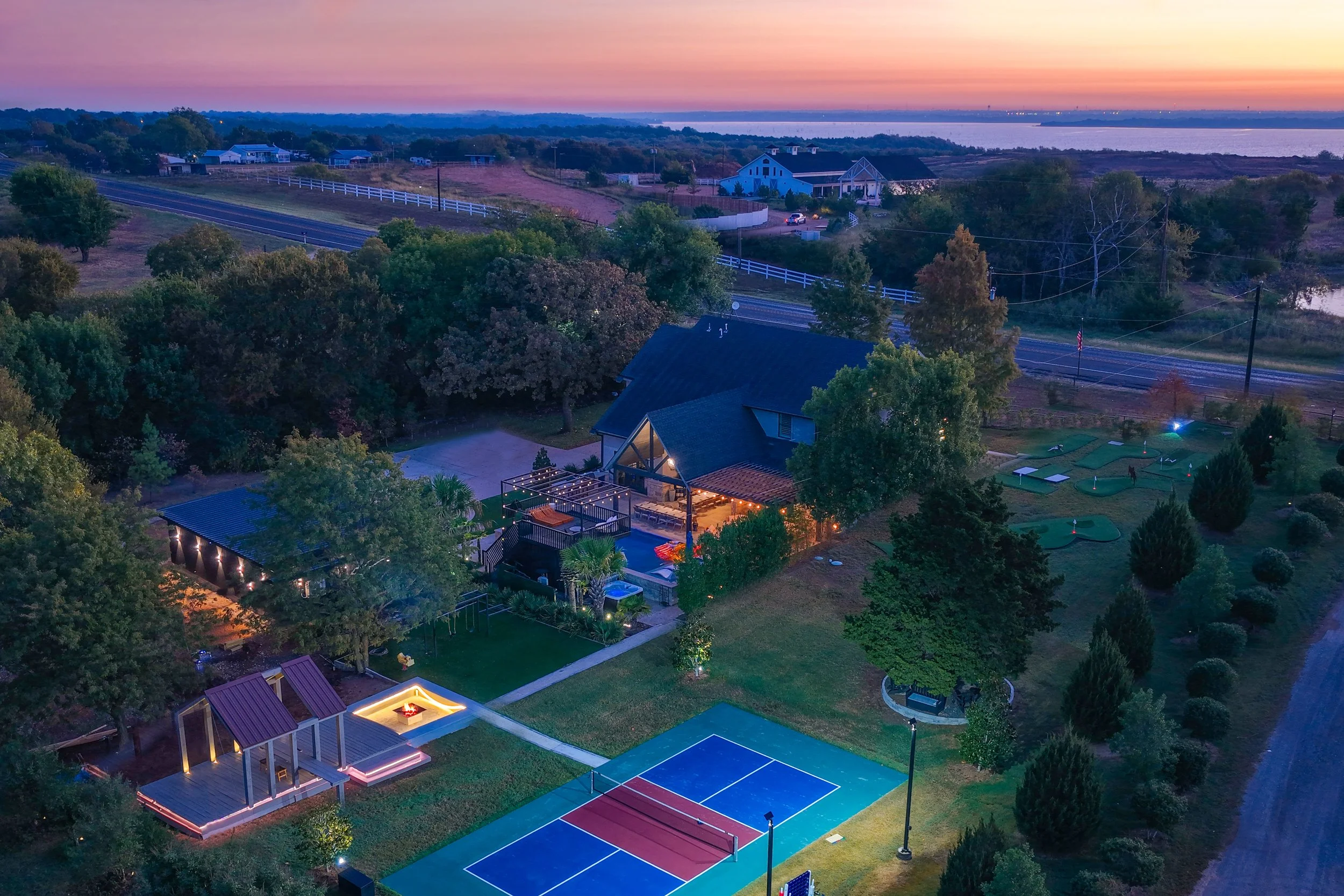 Twilight wide view of The Penrose House estate Princeton TX